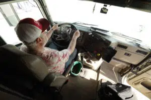 Driver behind the wheel of a Sisbro truck