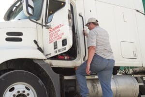 Sisbro driver climbing into his truck