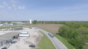 aerial shot of truck leaving lot