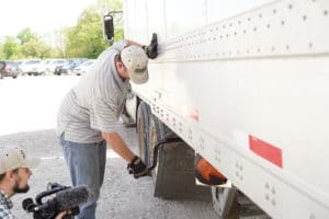 Sisbro truck driver maintaining truck