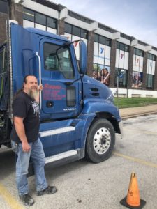 Sisbro truck and driver outside Quincy, Illinois YMCA
