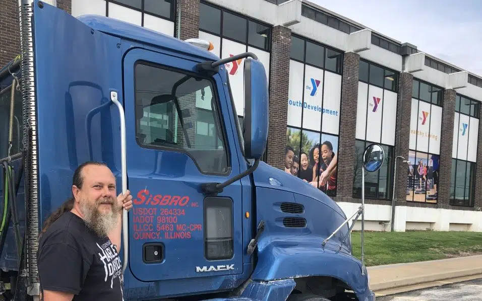 Sisbro truck and driver outside Quincy, Illinois YMCA