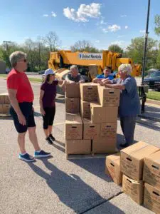 Volunteers and USDA food boxes in Quincy, Illinois YMCA parking lot