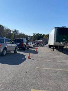 Line of cars by Sisbro trailer in Quincy, Illinois YMCA parking lot