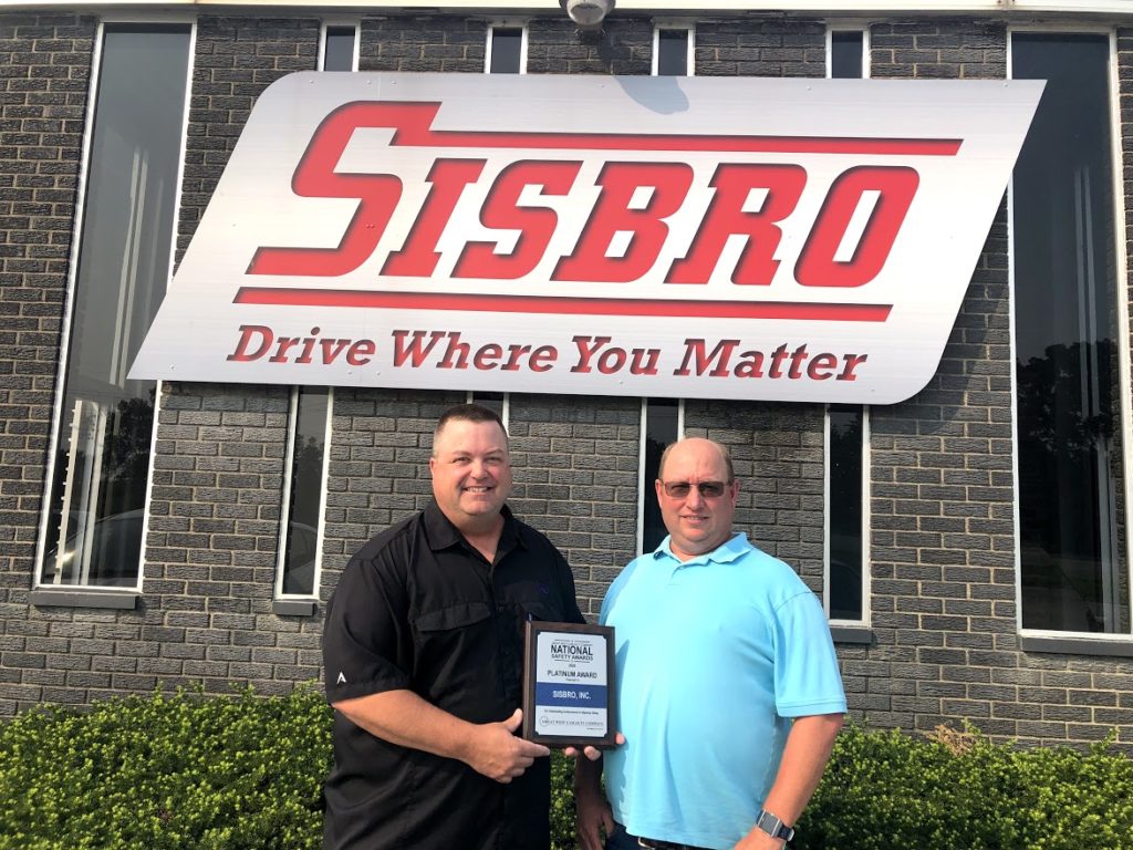 Great West Casualty Company Safety Representative presenting Sisbro Director of Safety Glenn Meyers with 2020 Platinum plaque for National Safety Award