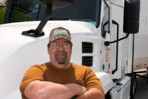 Man standing in front of Semitruck